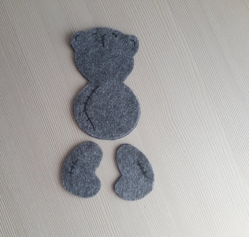 Broderte elementer på Teddys kropp og hode